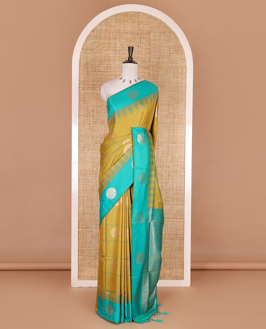 Green round peacock chakram buttas enclosed checked Mulberry silk saree, contrast round peacock chakra border, zari worven pallu, and contrast zari blouse