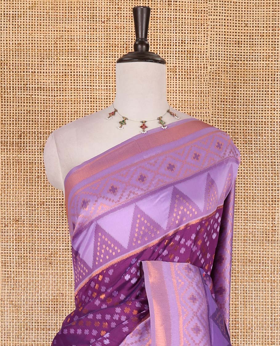 Dark violet ikkat style zari and thread buttas semi-tussar saree, contrast ikkat design border, geometric patterned pallu, and a contrast blouse