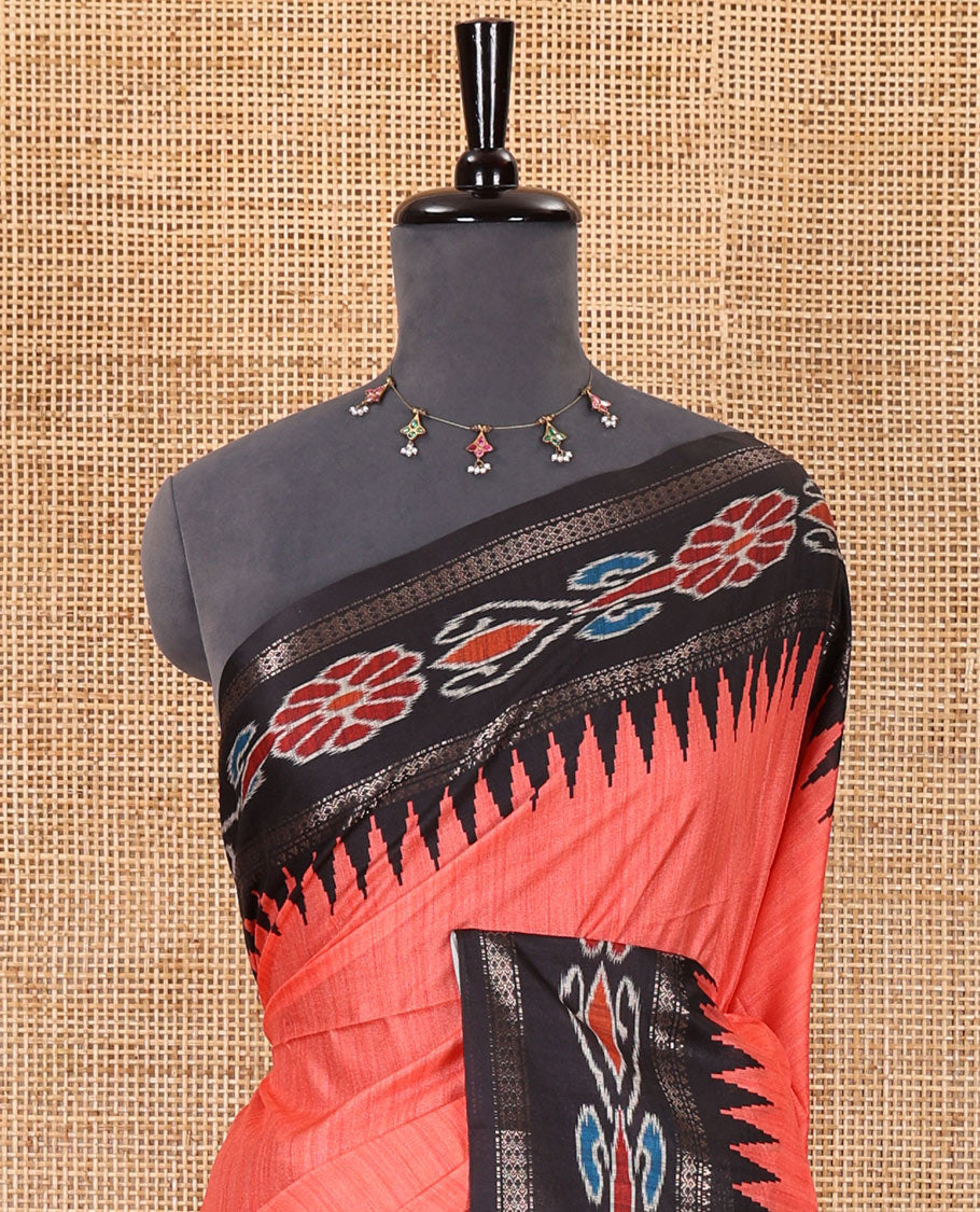 Tomato pink plain Katan silk saree, contrast temple ikkat floral printed border, ikkat floral printed pallu, and ikkat printed blouse