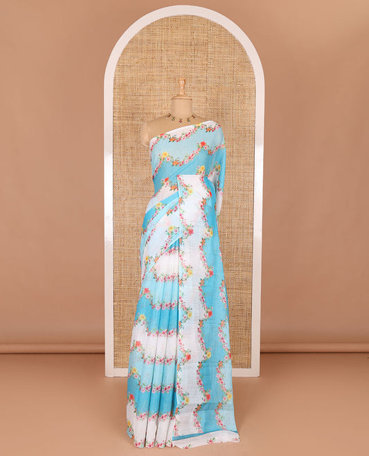 Borderless blue rangkat style dyed and floral printed linen cotton saree with a contrast printed blouse