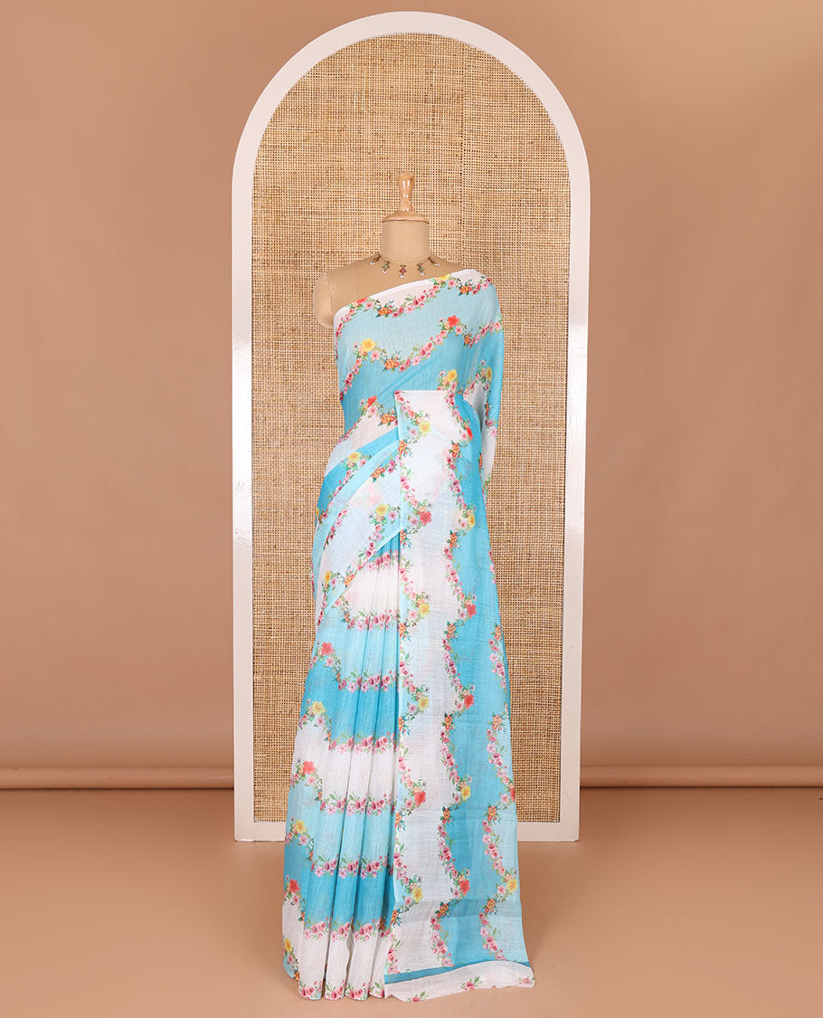 Borderless blue rangkat style dyed and floral printed linen cotton saree with a contrast printed blouse