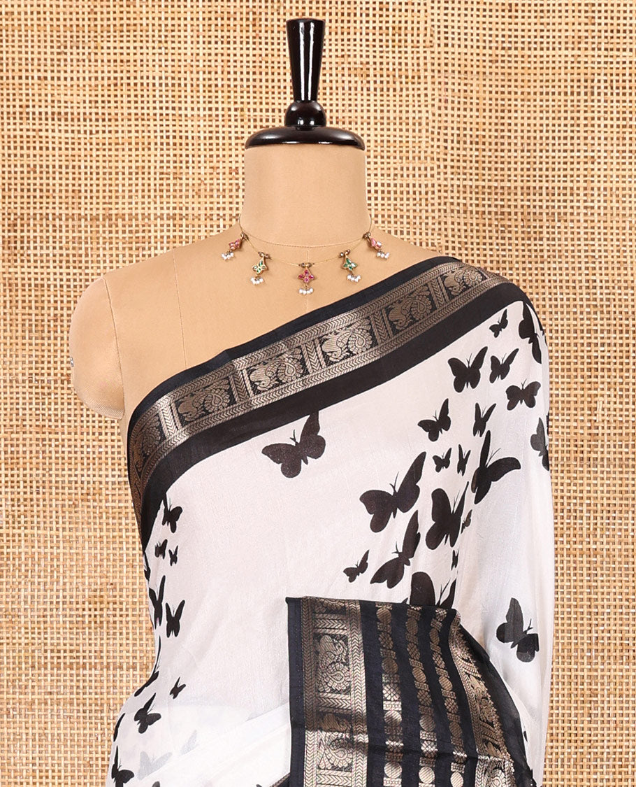 White and black butterflies printed dola silk saree, contrast traditional zari border, printed pallu, and a contrast plain blouse