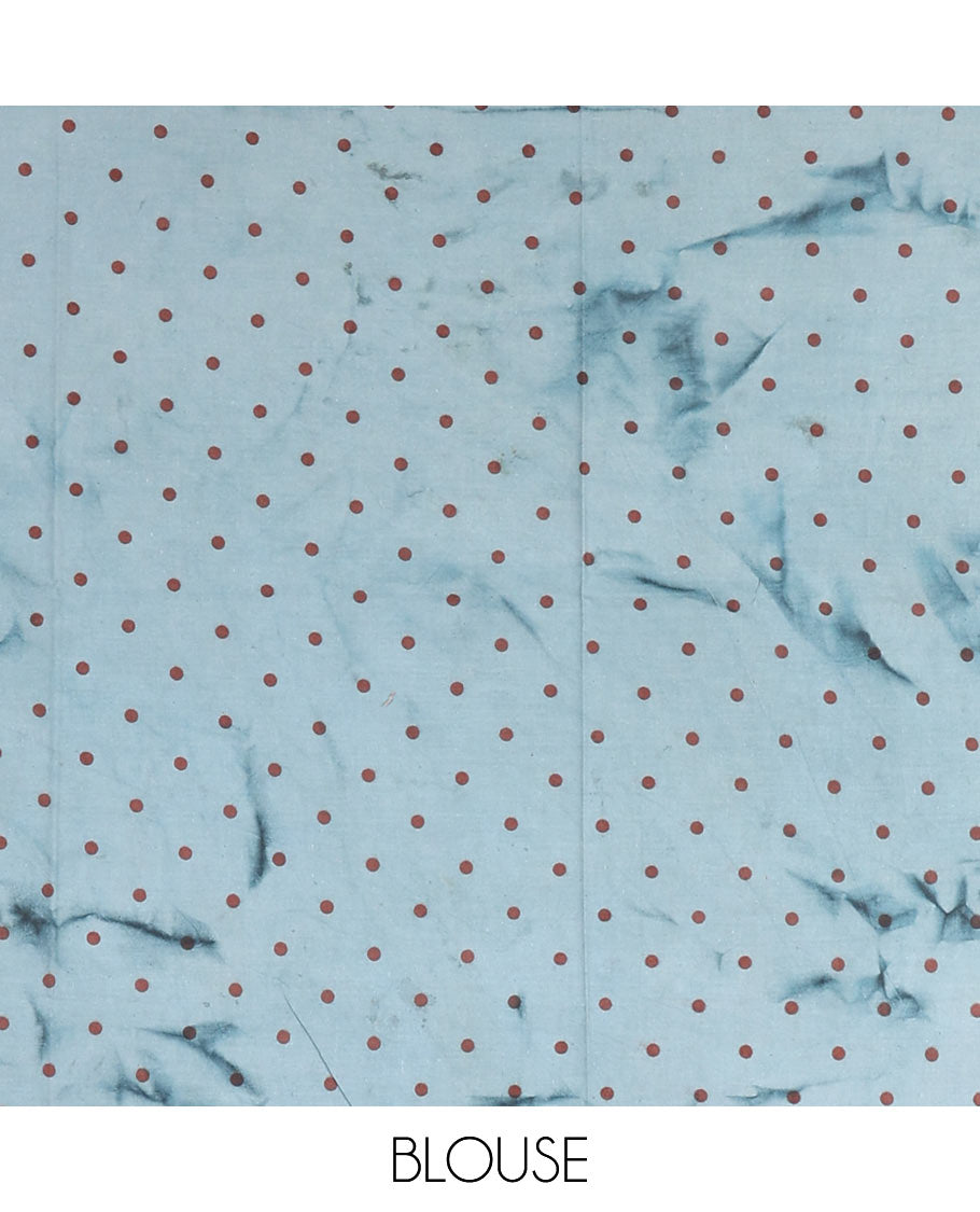 Sky blue lotus printed soft cotton saree, piping border, printed pallu, and a shibori printed blouse of polka dots