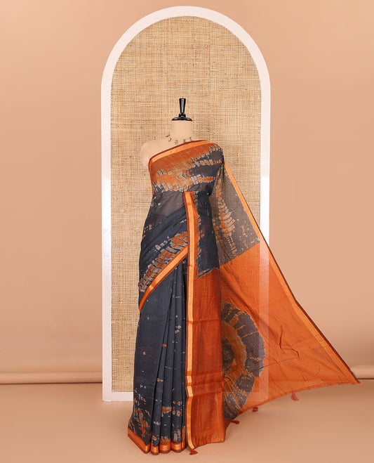 Black shibori printed muslin cotton saree, contrast gold zari border, shibori printed pallu, and shibori printed blouse