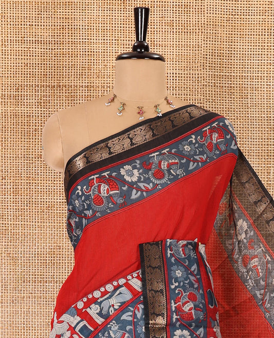 Red kalamkari ancient human figurines machine-printed muslin cotton saree, contrast traditional design zari border, kalamkari printed pallu, and contrast floral motifs and zari bordered blouse