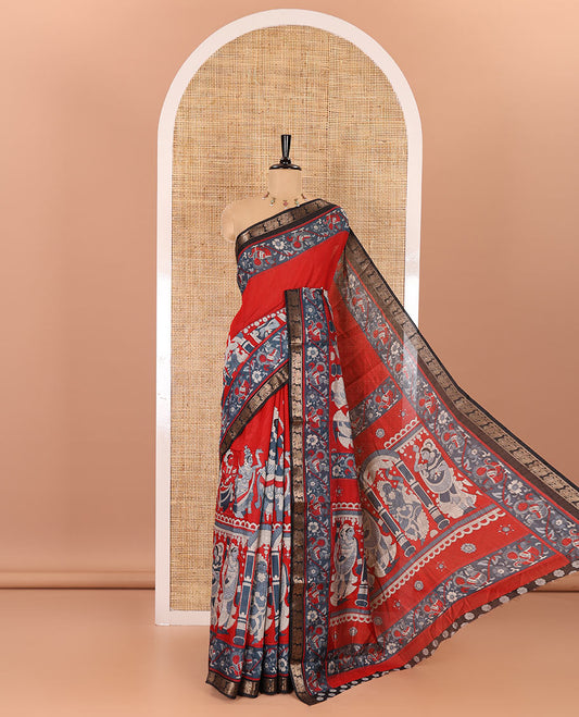 Red kalamkari ancient human figurines machine-printed muslin cotton saree, contrast traditional design zari border, kalamkari printed pallu, and contrast floral motifs and zari bordered blouse