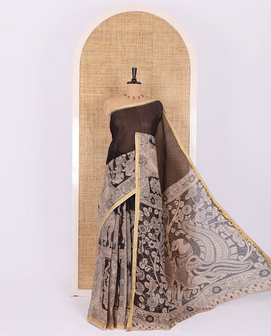 Black kalamkari ancient human figurines printed kota cotton saree, zari piping border, kalamkari floral-peacock printed pallu, and a contrast kalamkari printed blouse