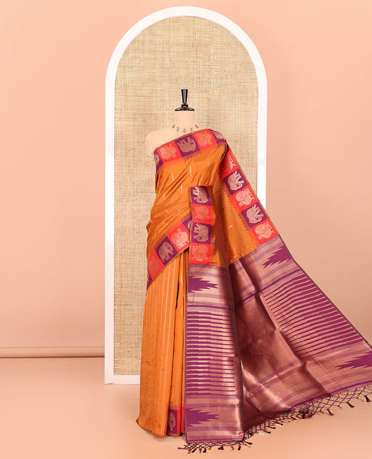 Rust orange copper zari buttas woven kanchi silk saree, contrast temple border of peacock and elephant motifs, zari-rich pallu, and a zari design blouse