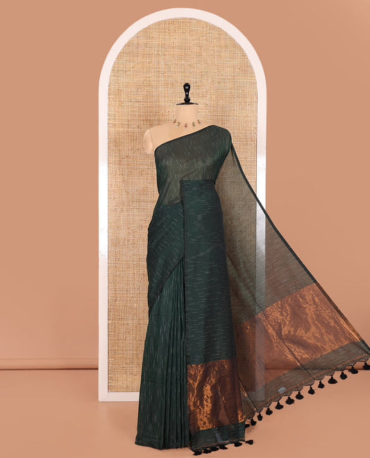 Borderless Green Khadi Mul Cotton Saree Decked with Jharna-Style Waterdrop Motifs, Featuring a Gleaming Zari-Woven Pallu, Paired with a Matching Blouse Replicating the Body Motifs