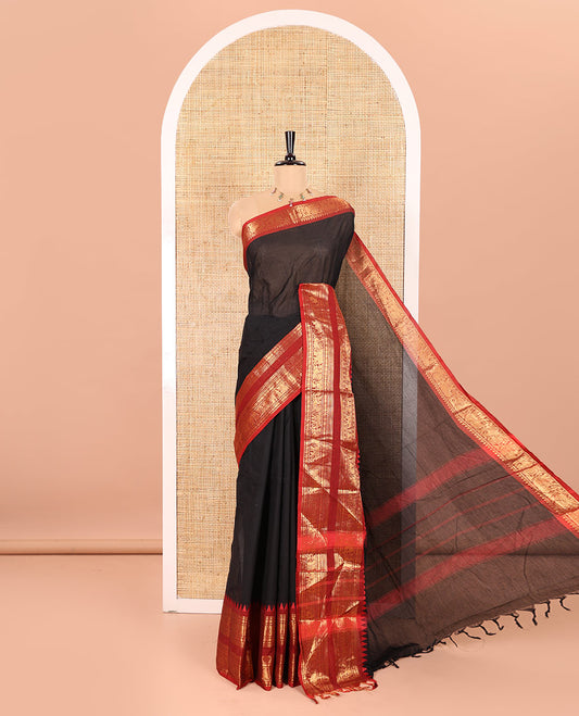 Black Plain Chettinad Cotton Saree Elevated with a Contrasting Temple Rettai Pettu Border of Peacock-Elephant Motifs, a Subtle Pallu of Stripes, and a Matching Blouse