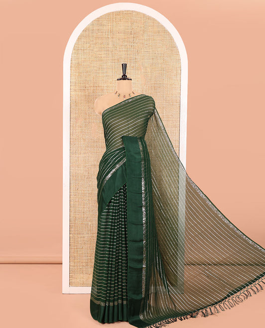 Green Viscose Georgette Saree Gleamed with Horizontal Golden Zari Stripes All Over Its Body,  by a Satin Plain Border, a Self Pallu Featuring the Same Horizontal Stripes, and Paired with a Running Blouse