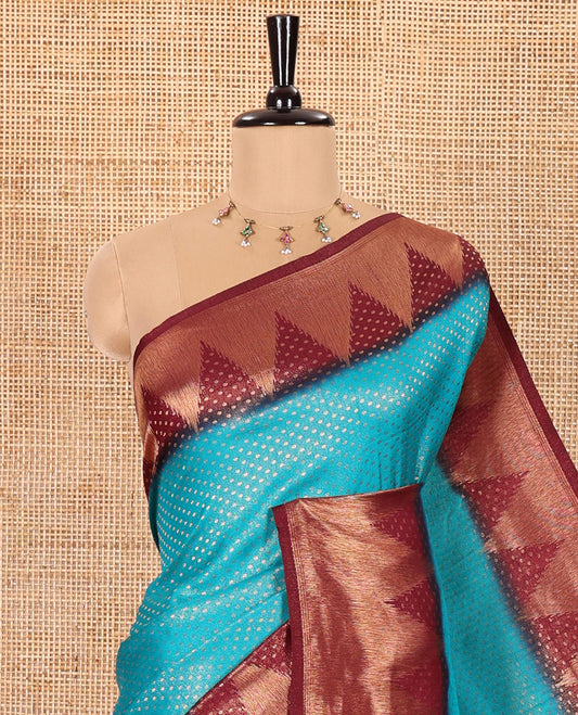 Blue Luxury Soft Silk Saree Accentuated with 1000 Zari Buttas All Over Its Body, Complemented by a Contrast Temple Zari Border, Grandly Woven Pallu of Jaal Designs, and Paired with a Contrast Jacquard Blouse