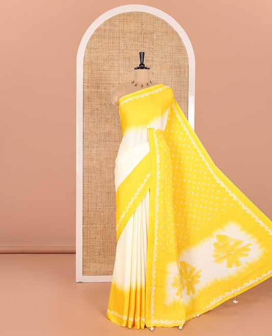 Cream and Yellow Satin Crepe Saree Embellished with Shibori Prints, Complemented by Contrast Shibori Printed Border, Pallu Decked Up with Shibori Prints, and Paired with a Plain Blouse