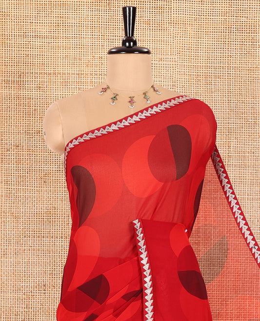Red Georgette Saree Colorfully Printed with Leheriya-Style Stripes, Subtly Temple Motifs Sequin Embroidered Piping Border, and Paired with a Matching Diamond-Patterns Printed Blouse