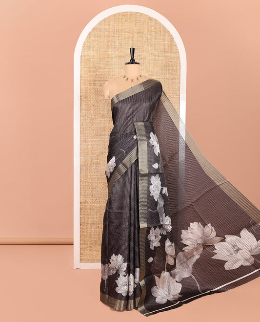 Black Semi Tussar Featuring Micro-Checks and Elegant Lotus Prints All Over Its Body, a Subtle Border, Pallu Mirrors Lotus Motifs, and Comes with a Matching Blouse