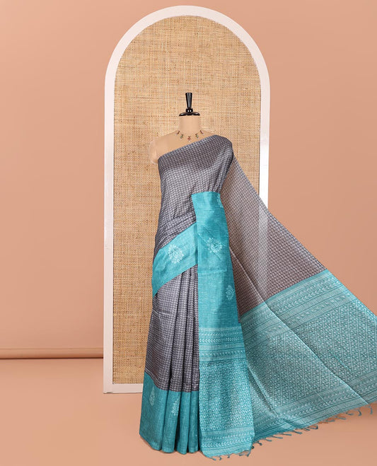 Grey and Rama Semi-Tussar Saree, Prettified with Geometric Patterns Printed All Over Its Body, Complemented by a Captivating Contrast One-Sided Border of Unique Print, and Paired with a Contrast Blouse