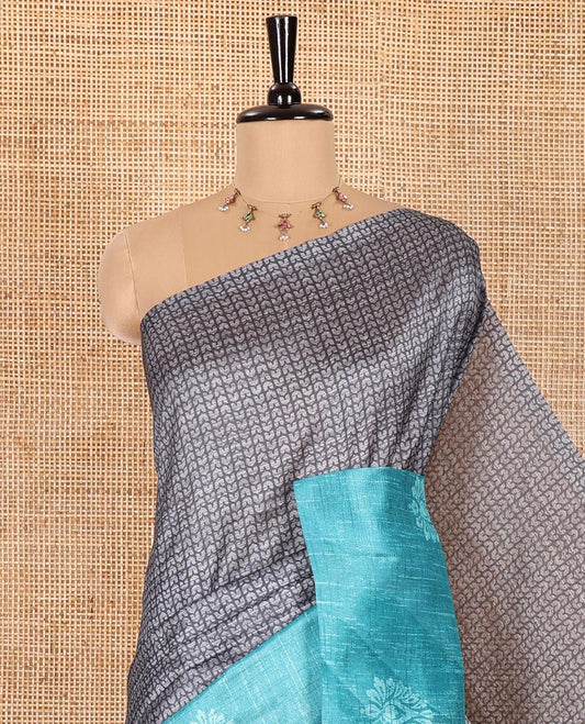 Grey and Rama Semi-Tussar Saree, Prettified with Geometric Patterns Printed All Over Its Body, Complemented by a Captivating Contrast One-Sided Border of Unique Print, and Paired with a Contrast Blouse