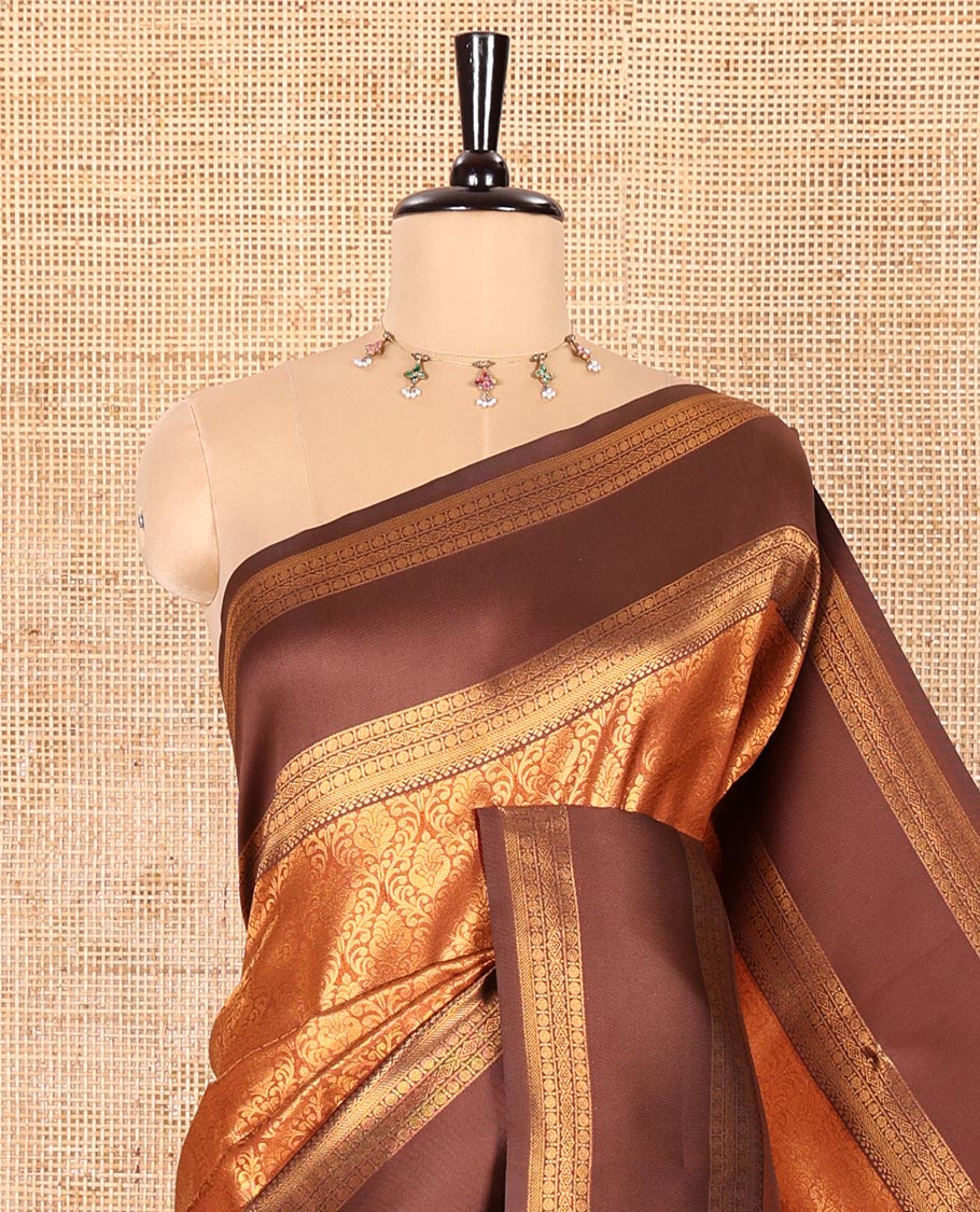 Rust Orange Kanchi Silk Saree, Highlighted with Jacquard Zari Design All Over Its Body, Complemented by a Contrast Rettai Pettu Traditional Zari Border, Opulently Embellished Pallu, and Paired with a Contrast Jacquard Blouse