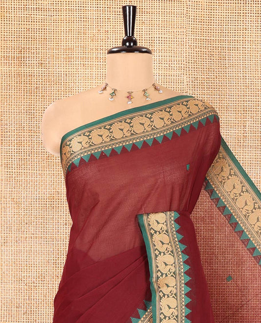 Maroon Chettinad Cotton Saree, Finely Woven with Thread Buttas All Over Its Body, Complemented by a Contrast Temple Border of Peacock Designs, Pallu of Buttas and Stripes, and Paired with a Matching Blouse