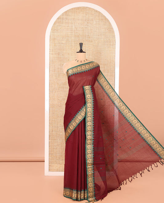 Maroon Chettinad Cotton Saree, Finely Woven with Thread Buttas All Over Its Body, Complemented by a Contrast Temple Border of Peacock Designs, Pallu of Buttas and Stripes, and Paired with a Matching Blouse