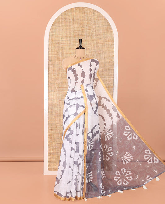 White-Grey Linen Cotton Saree, Accentuated with Shibori-Printed Body, Highlighted by Piping Border,  Floral Printed Pallu, and Contrast Blouse