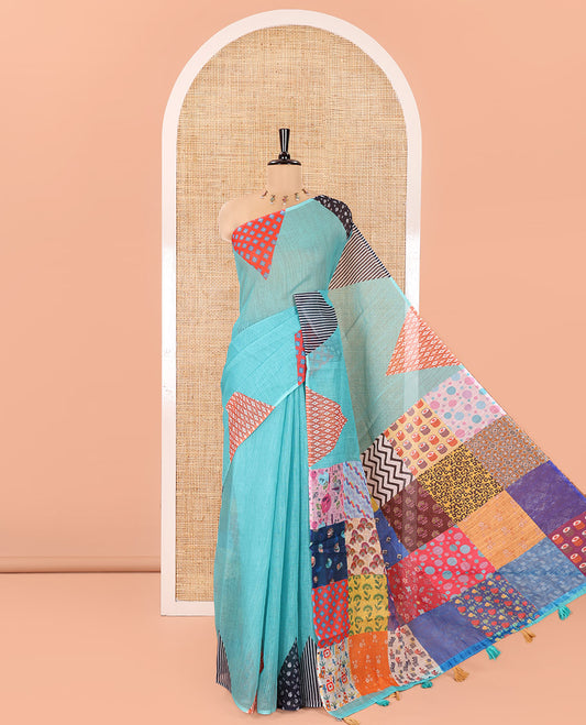 Blue Plain Linen Cotton Saree, Complemented by a Contrast-Colored Triangle on Its Border, Kaleidoscopic-Color Patchwork Pallu, and Paired with a Contrast Blouse