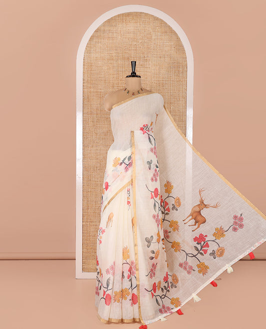 Cream Linen Cotton Saree, Adorned with Floral Vine and Deer Motifs All Over Its Body, Subtle Piping Border, a Self-Pallu, and Paired with a Matching Blouse