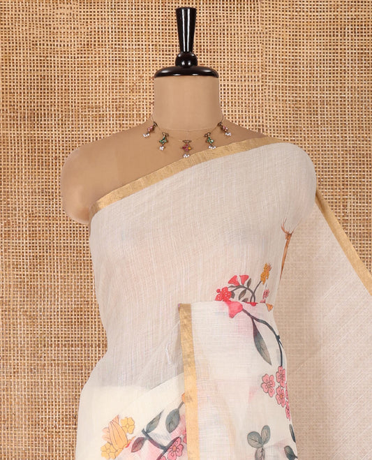 Cream Linen Cotton Saree, Adorned with Floral Vine and Deer Motifs All Over Its Body, Subtle Piping Border, a Self-Pallu, and Paired with a Matching Blouse