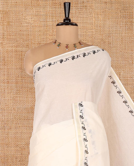 Cream Plain Kerala Cotton Saree, Subtly Printed With Floral Creeper Motifs Border, Floral Printed Pallu, and Paired with a Matching Blouse