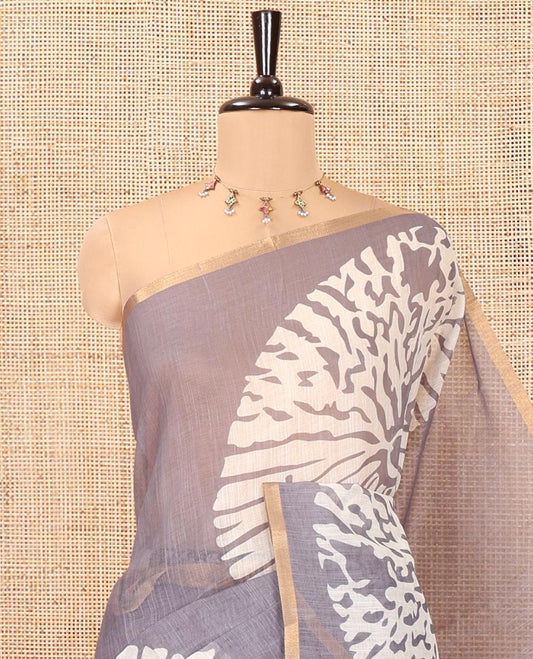 Grey Linen Cotton Saree, Mesmerized with Floral Motifs Printed on Its Body, Subtle Piping Border, Complemented by a Contrast Floral Printed Blouse, and Paired with a Contrast Blouse