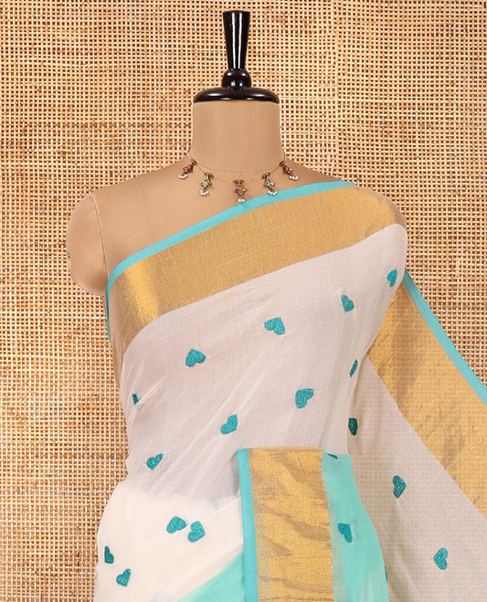 Cream and Rama Green Khadi Mul Cotton Saree, Adorned with Half-And-Half-Style and Heart Motifs Embroidery on Its Body, a Subtle Gold Zari Border, a Self-Pallu, and Has No Blouse