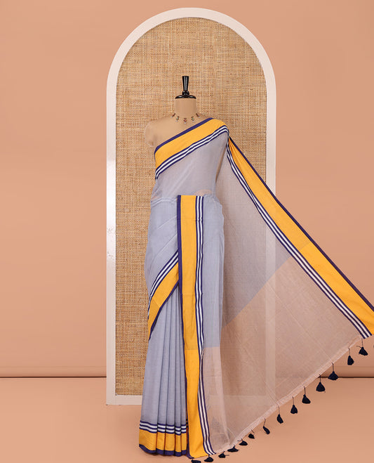 Grey Plain Khadi Mul Cotton Saree, Complemented by a Contrast Yellow Border, a Self-Pallu, and Has No Blouse