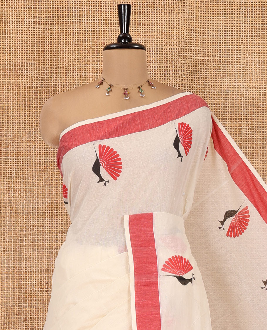 Cream Kerala Cotton Saree, Subtly Sparkled With Peacock Print, a Contrast Border, Pallu of Peacock Print and a Matching Blouse