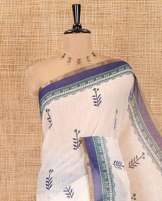 Cream-Blue Linen Cotton Saree Features Floral Buttas, Contrast Printed Border, Intricate Pallu, and a Contrast Blouse