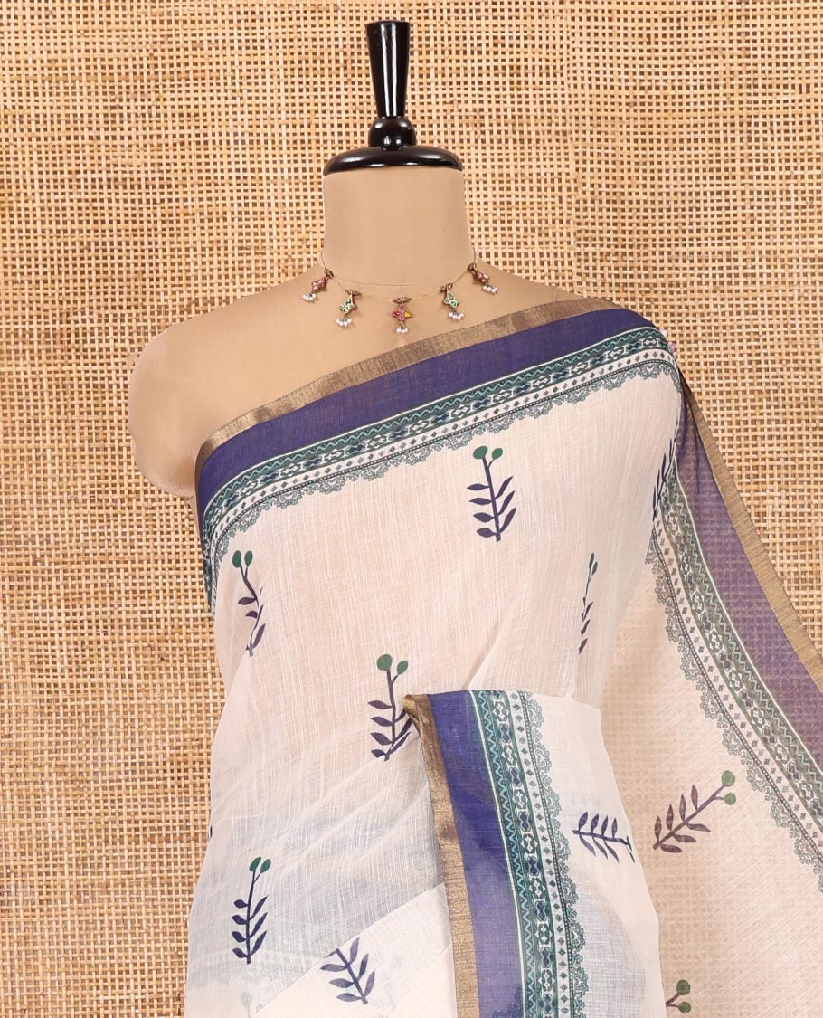 Cream-Blue Linen Cotton Saree Features Floral Buttas, Contrast Printed Border, Intricate Pallu, and a Contrast Blouse