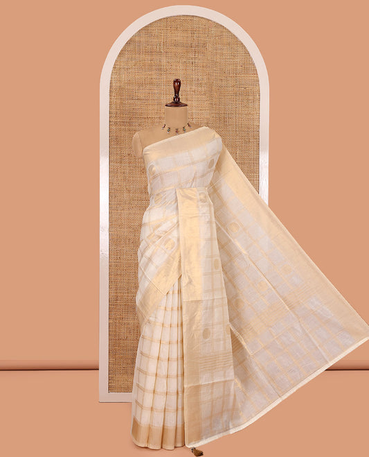 Cream Chanderi Cotton Saree Features Polka Dot Enclosed Checks, a Zari Border, a Matching Blouse
