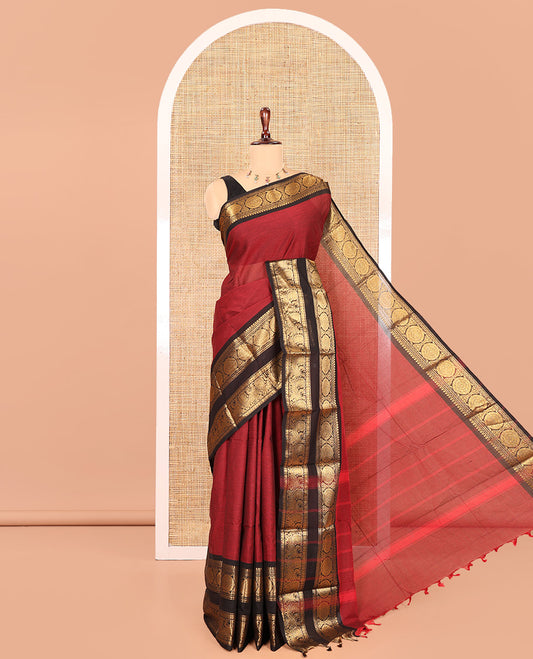 Maroon Chettinad Cotton Saree, a Contrast Peacock-Chakra Rettai Pettu Border, Striped Pallu, and Matching Blouse