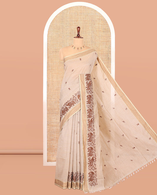 Cream Chanderi Cotton Saree Features Floral-Elephant Embroidery, a Contrast Border, and a Matching Blouse