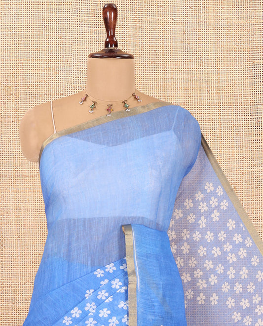 Blue Linen Cotton Saree Features Half-And-Half-Style Flower Motifs Print, a Piping Border, and a Matching Blouse