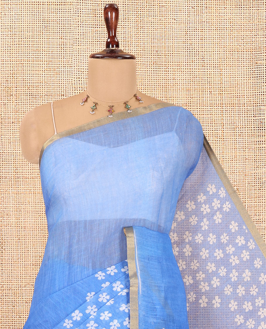 Blue Linen Cotton Saree Features Half-And-Half-Style Flower Motifs Print, a Piping Border, and a Matching Blouse