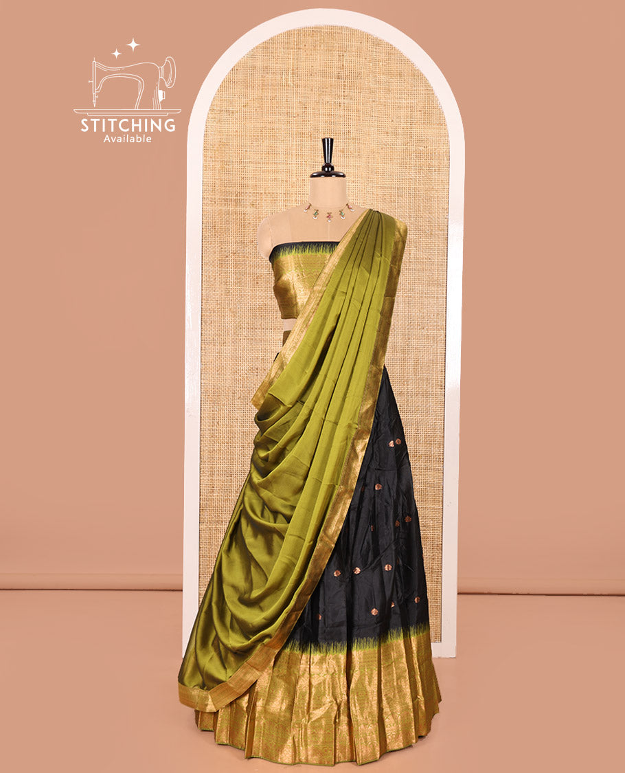 Black and Green Semi-Banaras Half-Saree Featuring Zari Buttas All Over the Skirt, Accentuated with a Contrast Traditional Zari Design Border, Paired with a Matching Blouse, and Has a Plain Syska Georgette Dhavani with a 4-Sided Zari Border