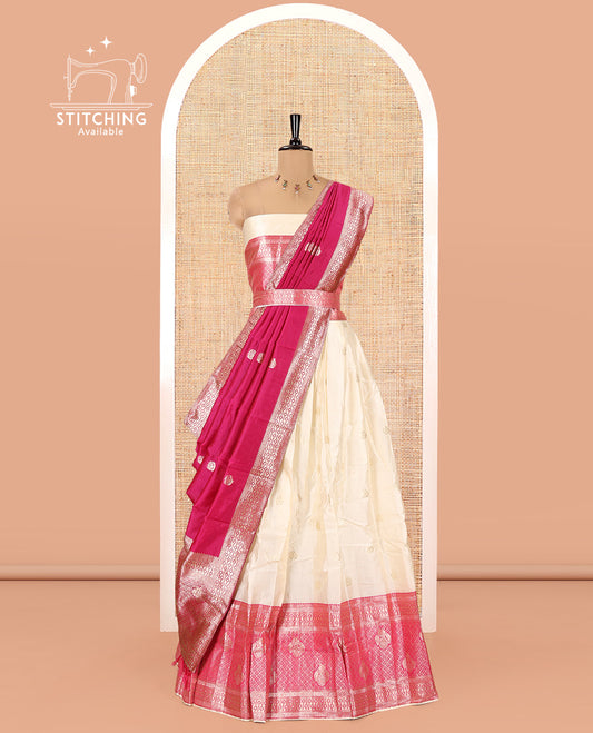 Cream-Rani Pink Semi-Banarasi Half-Saree Set Featuring Buttas Skirt, Contrast Traditional Border, a Matching Blouse, and a Banaras Dhavani