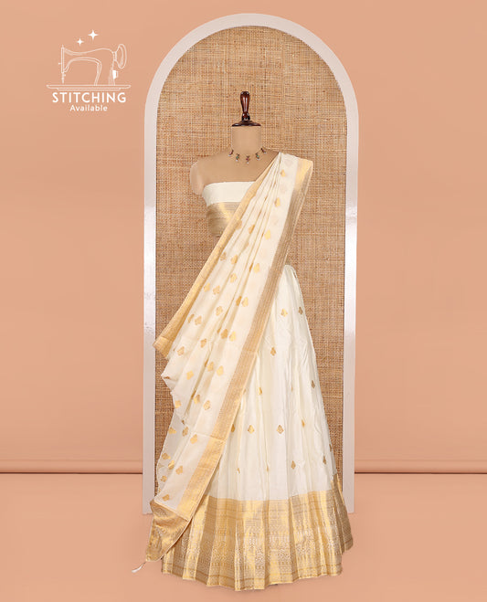 Cream Banarasi Silk Half-Saree Features Zari Buttas Skirt, a Traditional Border, Matching Blouse, and Zari-Woven Dhavani
