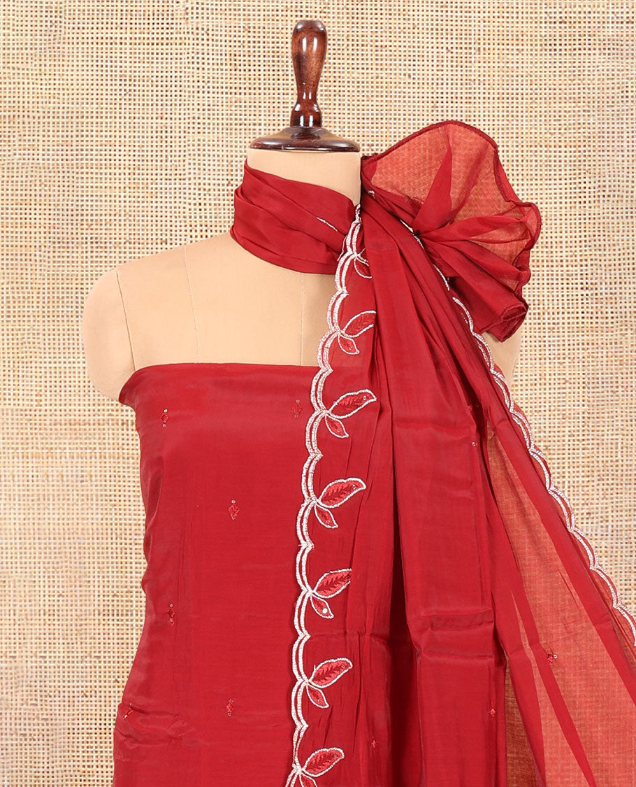 Maroon Mul Chanderi Material Churidar Features a Floral Outline Embroidered Top, a Santoon Bottom, a Scallop Threadwork Dupatta