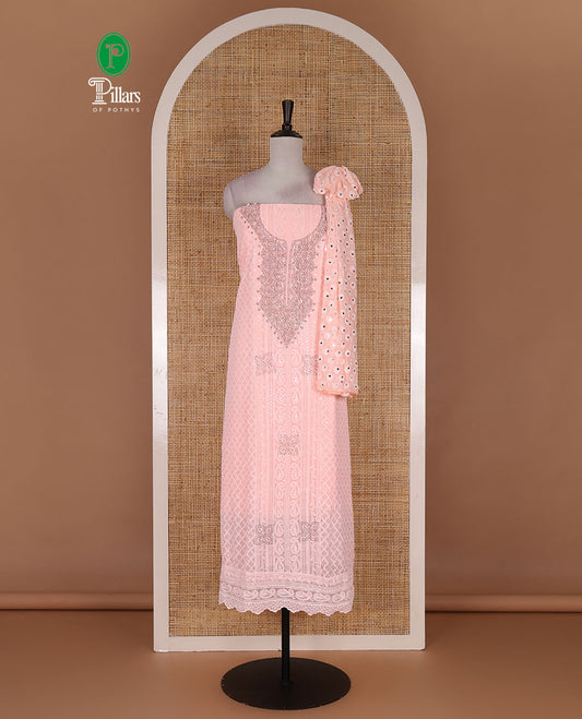 Peach material churidar set, stone work with Schiffli style embroidered georgette top, American Crape bottom, and polka dotted printed mirror work dupatta