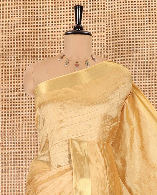 Gold zari buttas and striped banana pith saree, bavanji border, zari striped pallu, and a matching blouse