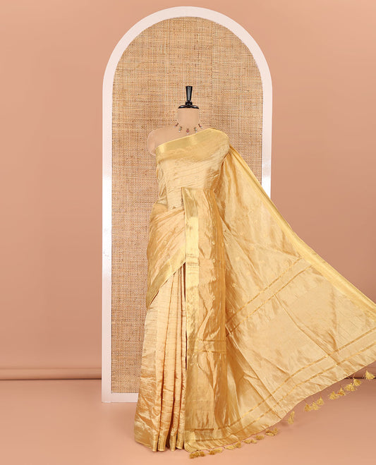 Gold zari buttas and striped banana pith saree, bavanji border, zari striped pallu, and a matching blouse
