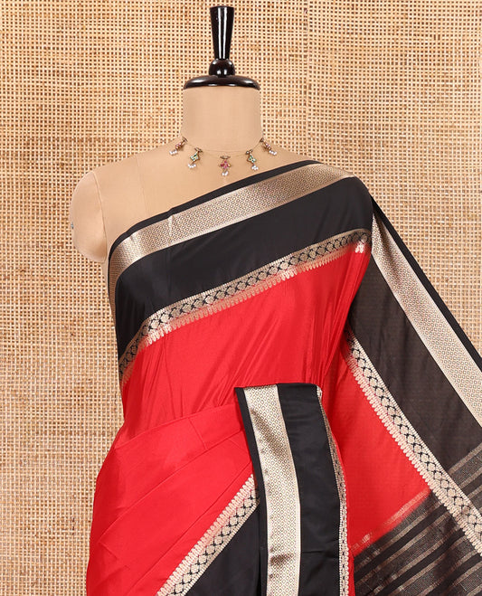 Red and Black Plain Semi-Mysore Silk Saree, Complemented by a Contrast Rettai Pettu Traditional Zari Border of Diamond Designs, Pallu Steeped with Gleaming Zari Stripes, and Paired with a Contrast Blouse