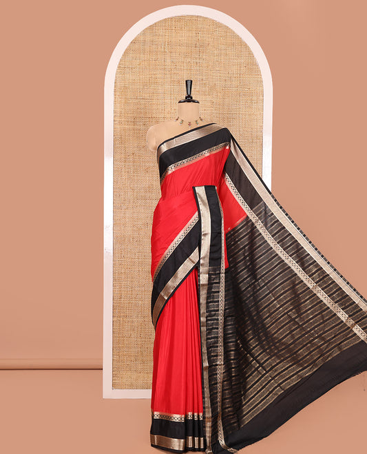 Red and Black Plain Semi-Mysore Silk Saree, Complemented by a Contrast Rettai Pettu Traditional Zari Border of Diamond Designs, Pallu Steeped with Gleaming Zari Stripes, and Paired with a Contrast Blouse