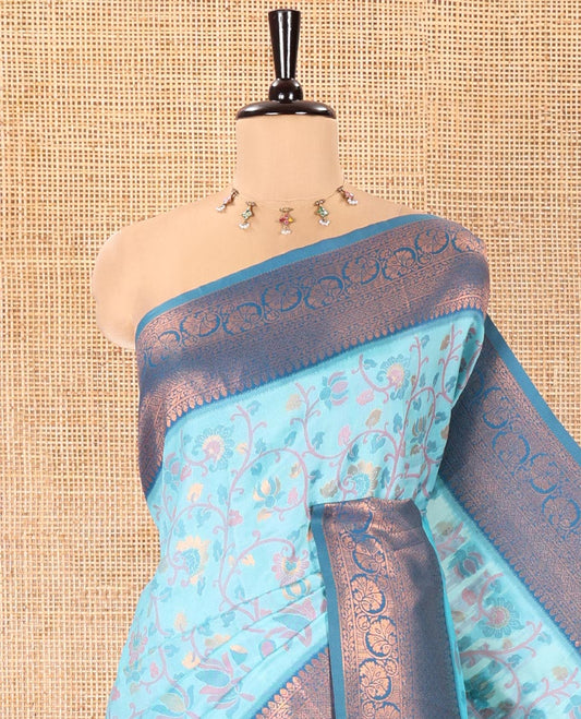 Sky Blue Litchi Saree, Bedecked with Floral Vine in Resham and Zari Thread Designs, Complemented by Contrast Floral Zari Border, Grand Jaal Design Pallu, and Paired with a Contrast Blouse